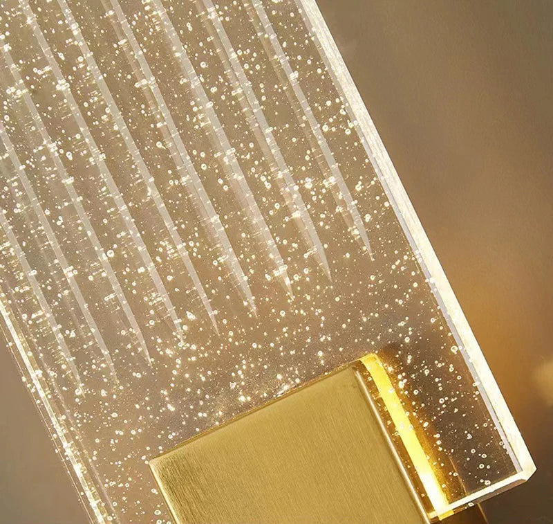 Modern bubble crystal LED wall sconces with a golden accent light