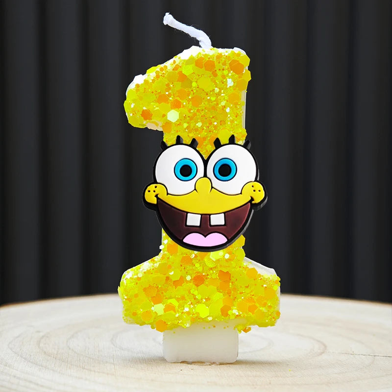 A SpongeBob character shaped candle in the form of the number one, covered in yellow glitter.