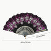 A black folding fan decorated with purple and white floral patterns.
