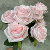 A bouquet of nine pink and white silk roses for weddings and home decor