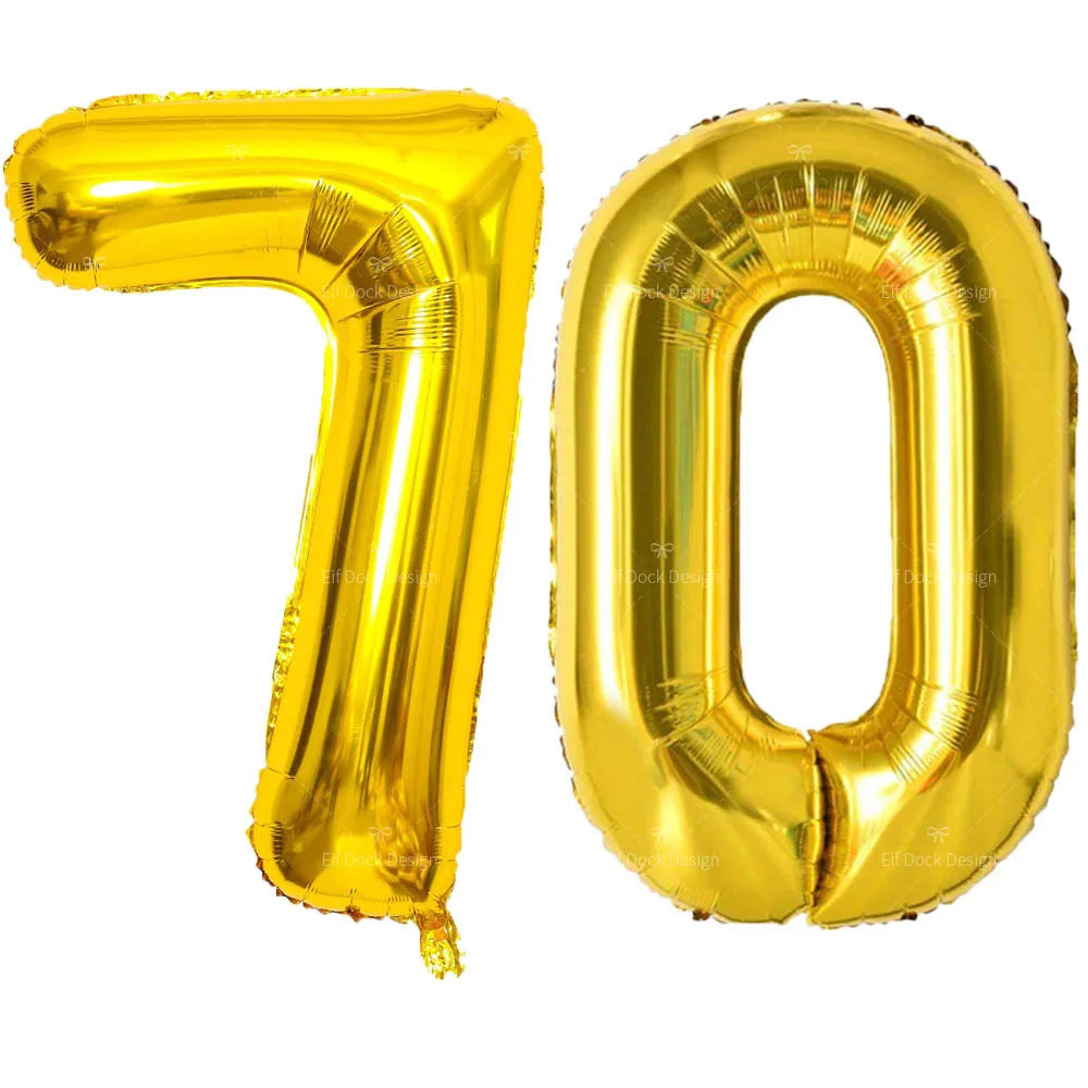 A large, shiny gold foil balloon shaped like the number 70.