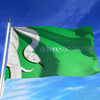 A green flag featuring a white bird silhouette, used as wall decor.