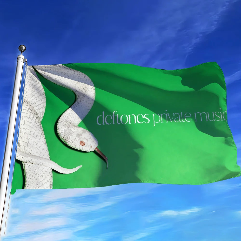 A green flag featuring a white bird silhouette, used as wall decor.