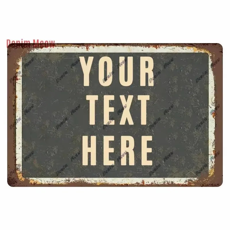 A rectangular, distressed metal tin sign with a dark gray background and light beige text that reads YOUR TEXT HERE.