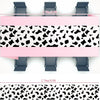 Pink cow print western tablecloth featuring a black and white spotted pattern.