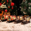 A collection of decorative Christmas train music boxes with LED lights and crystal balls resting on a snowy surface.