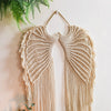 Handwoven angel wing macrame wall hanging in beige fiber