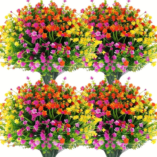 Un bouquet de fleurs artificielles aux couleurs vives comme le rouge, l'orange, le jaune et le rose, regroupées sur des tiges