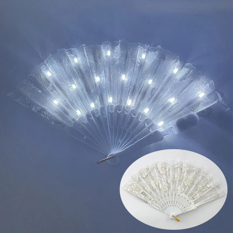 A silver LED dancing hand fan is shown open, emitting bright white light and creating a fan shape.