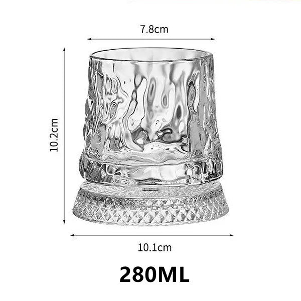 A clear crystal whiskey glass with a relief design, showing its dimensions and shape.