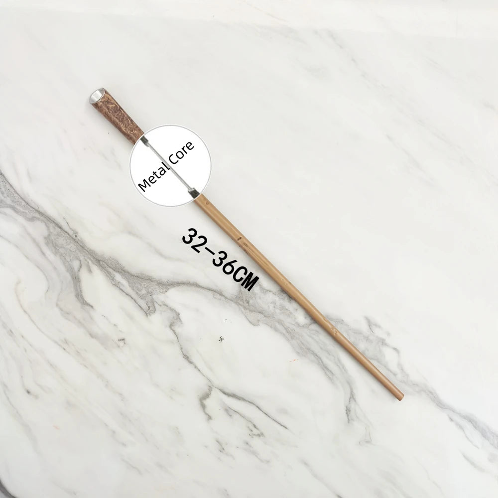 A wooden wand replica with a metal core is displayed on a white marble surface.