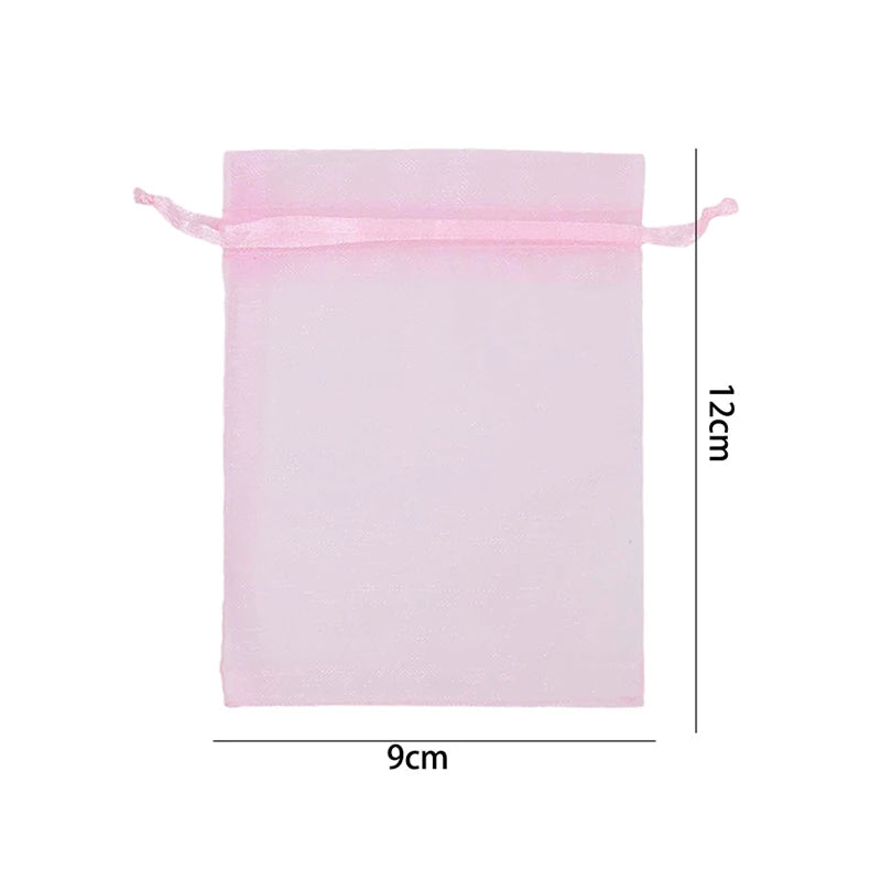 A rectangular pink organza drawstring gift bag with a 12cm height and 9cm width.