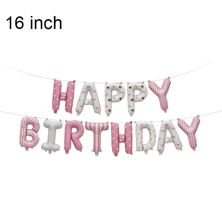 A banner made of pink and blue foil letter balloons spelling out Happy Birthday