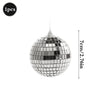 A spherical disco mirror ball made of silver sequins, used for parties and decor.