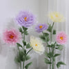 Large artificial silk purple and yellow poppy flowers displayed on green stands