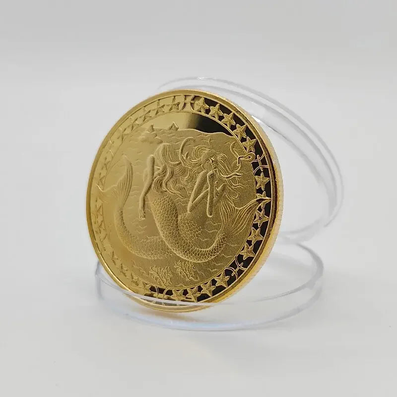 A round gold commemorative iron coin featuring a detailed zodiac animal design, displayed on a clear stand.