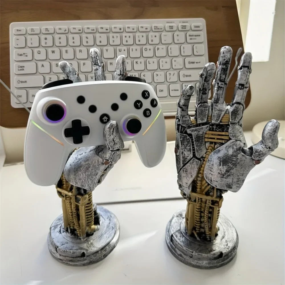 A gray and gold 3D gamepad controller storage organizer featuring a hand-shaped holder.