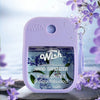 A purple Wish hydrating and moisturizing hand sanitizer spray bottle with a lavender orchid and sandalwood theme.