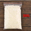 A clear plastic bag filled with white natural soy wax flakes for DIY candle making