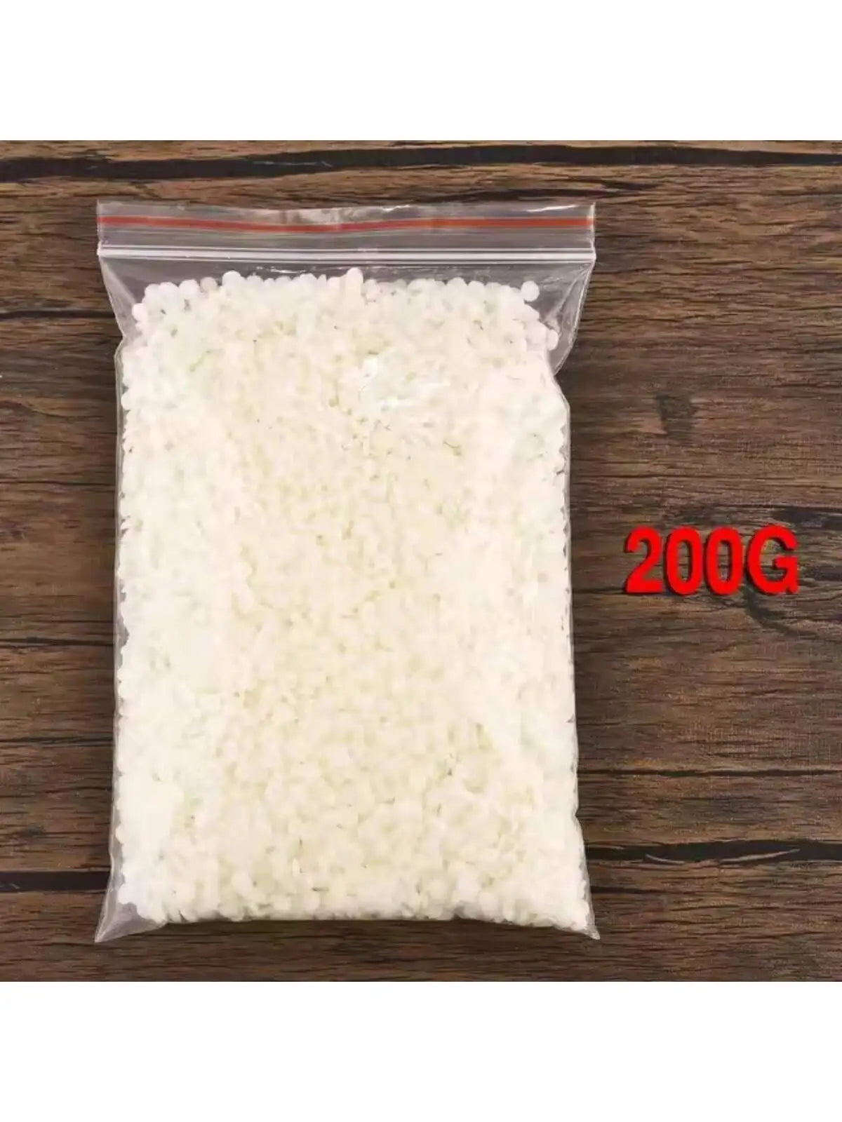 A clear plastic bag filled with white natural soy wax flakes for DIY candle making