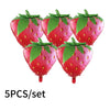 A set of five bright red strawberry-shaped foil balloons with green leaves.
