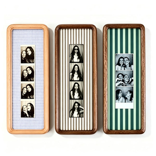 Three wooden photo strip frames with striped backgrounds displaying portraits of women.