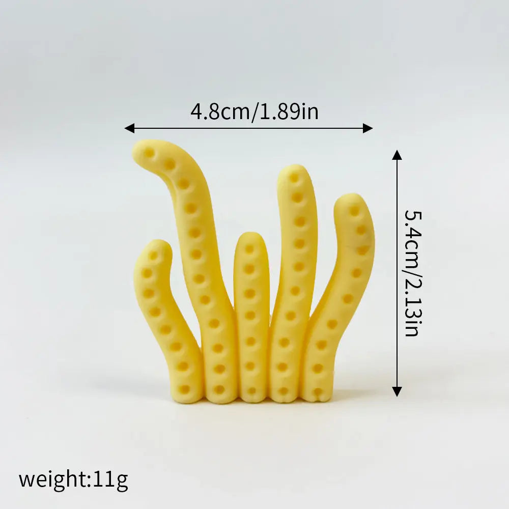 A set of yellow ocean animal cake toppers including a whale, octopus, and turtle.