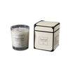 A rectangular candle in a cream and black box with a label, showing the 55g weight.