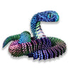 A vibrant blue and green 3D printed articulated snake fidget toy with textured scales.