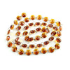 A strand of amber-colored crystal glass octagon beads used for home decor.