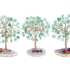 Three small crystal money tree decor plants with green leaves set on light colored bases.