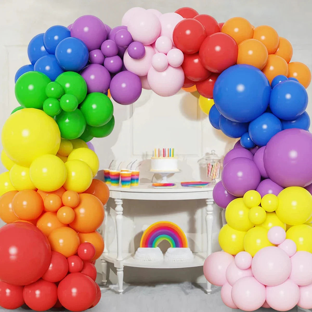 A colorful balloon garland arch kit featuring purple, pink, orange, and yellow balloons for party decorations.