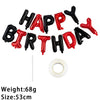 A string of 13 foil letter balloons spelling out HAPPY BIRTHDAY in black and red colors.