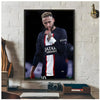 A framed poster of Neymar Jr in a dark shirt posing with his finger, displayed on a white brick wall.