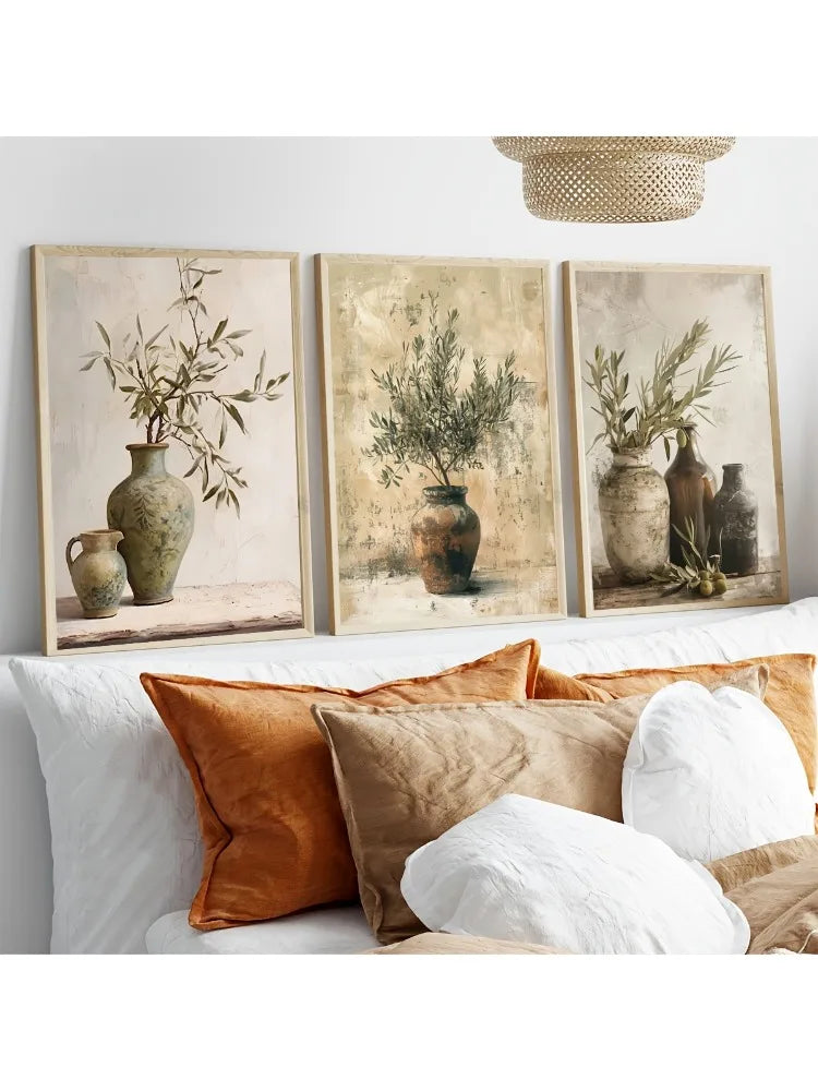 Three framed canvas prints featuring olive branches in antique pottery on a light background.