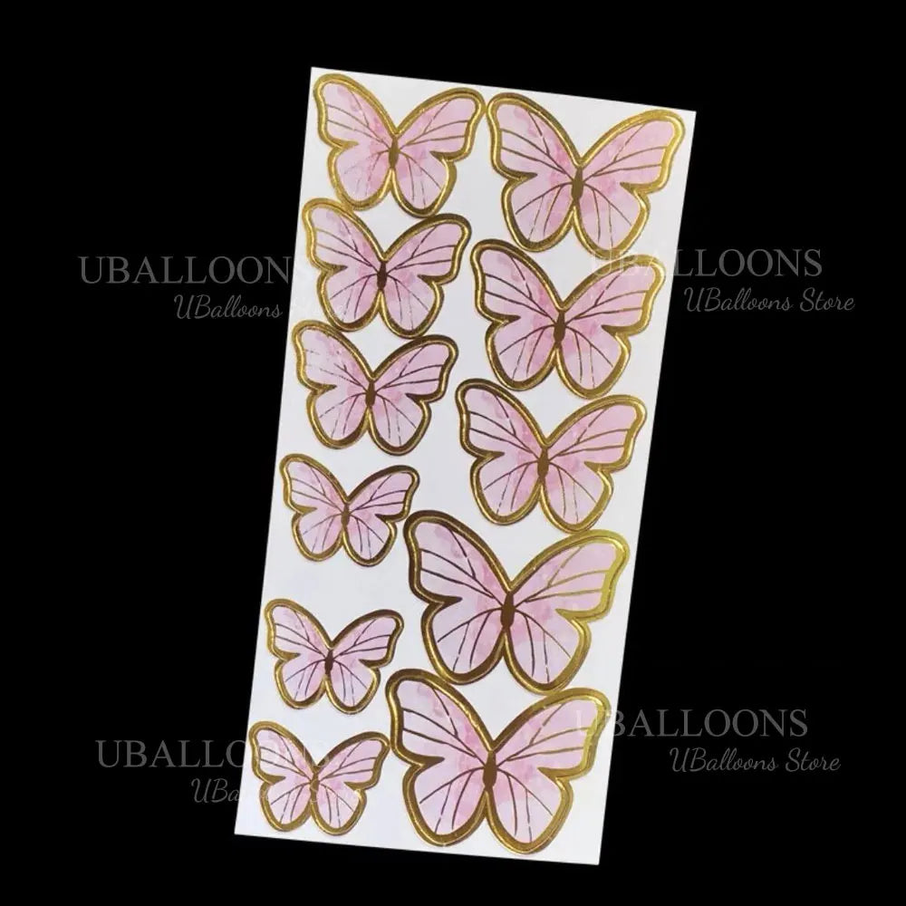 A set of eleven pink and gold butterfly cake toppers.