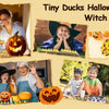 A collection of tiny ducks and a witch hat used for Halloween crafting and decoration.