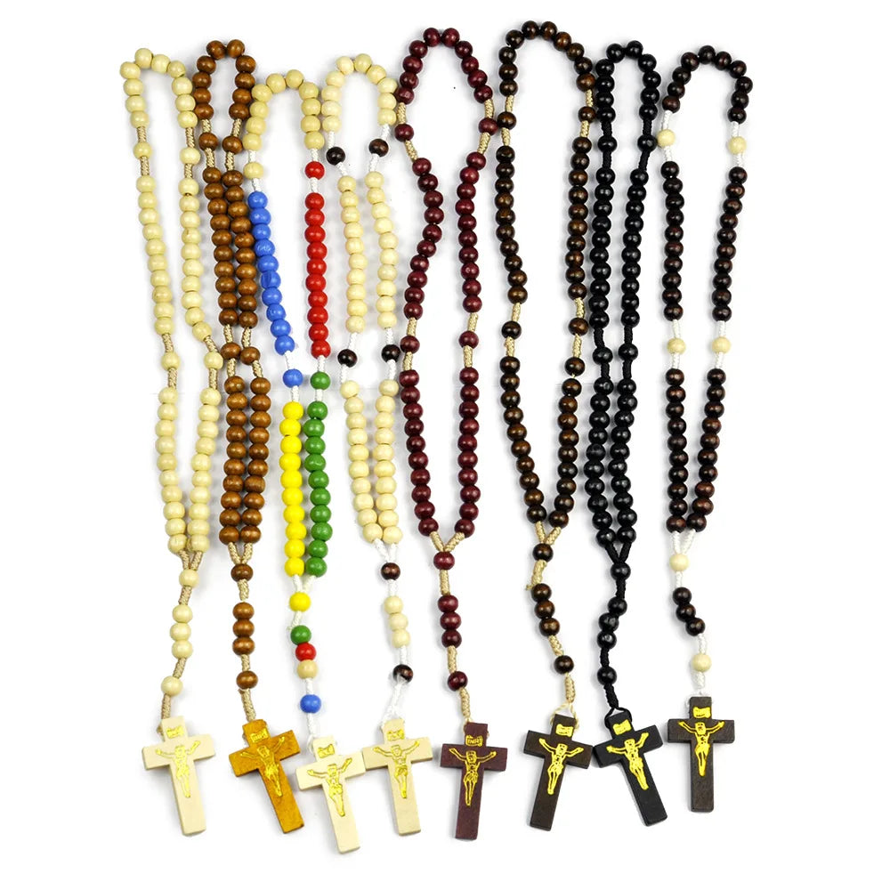 A collection of wooden rosary beads and necklaces featuring Jesus crucifix pendants.