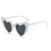 Pearl-embellished heart-shaped sunglasses with white frames for brides