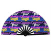 A folding fan with a dark blue background featuring repeated text designs in yellow and purple.