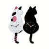 A whimsical black cat pendulum wall clock featuring a moving tail design.
