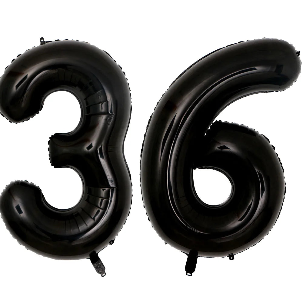 A set of two giant black foil balloons shaped like the number 36
