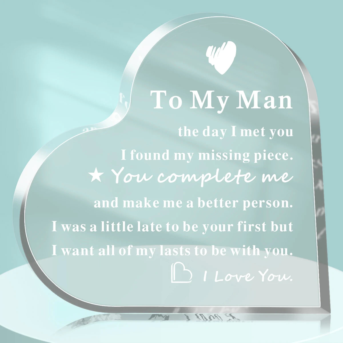 A clear acrylic heart keepsake plaque engraved with a message to her man.