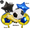 A set of five inflatable soccer balls and a football-themed boot balloon for party decoration