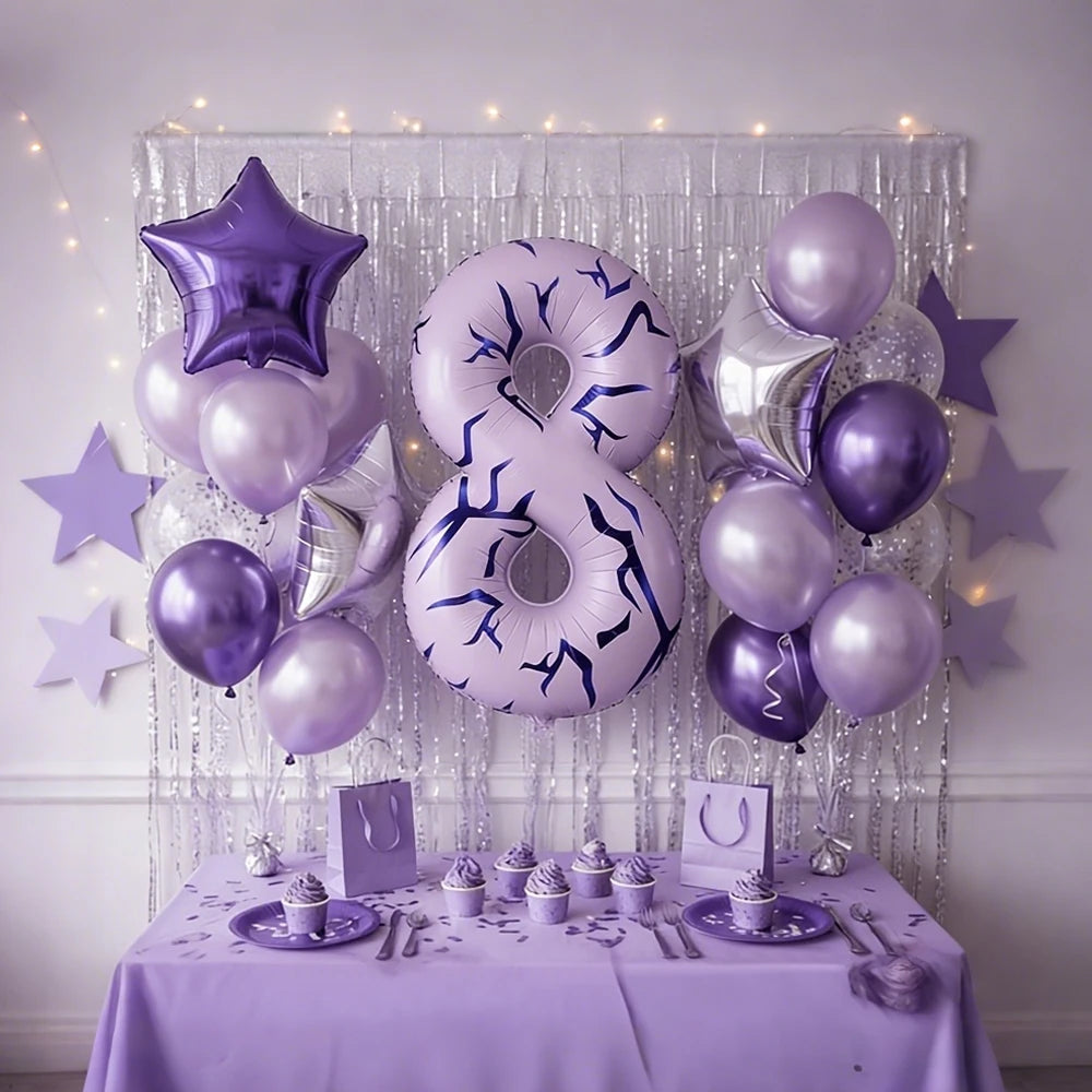Purple and silver balloons forming the number 8 decorated with stars and draped with sheer fabric