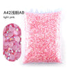 A42 glitter pink resin rhinestones in a pouch for crafting