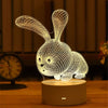 A white acrylic LED night light shaped like a rabbit, displayed on a wooden surface.