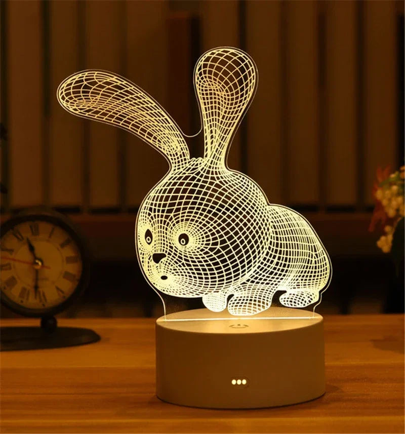 A white acrylic LED night light shaped like a rabbit, displayed on a wooden surface.