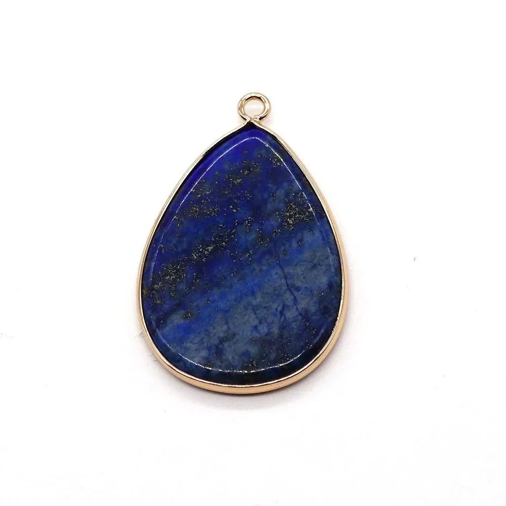 A teardrop-shaped blue agate pendant with a gold-colored bail.