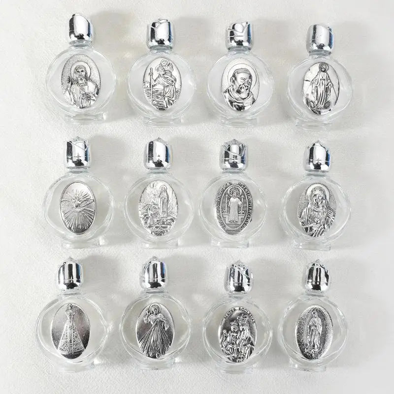 A set of eight decorative glass bottles, each containing a silver figurine and topped with a twist cap.